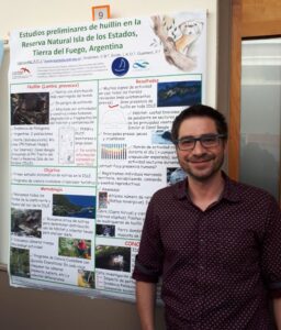 Person with scientific poster on otter study in Antarctica
